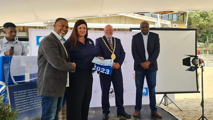 KEEPING THE BLUE FLAG FLYING HIGH Overstrand Municipality's Mayoral Committee Member for Community Services, councillor Ronald Nutt is congratulated by WESSA CEO Helena Atkinson. Seen with them are David Swart, the Executive Mayor Bitou Municipality and Jonga Kuhlane of the National Department of Tourism.