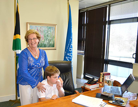 Overstrand Mayor, Nicolette Botha-Guthrie pictured in her office with Jack Kastner, an 8-year old attendee at the Stanford-based Butterfly Centre that caters for children with special needs.
