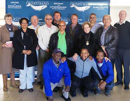 Pictured standing from left: Cllr Lisel Krige, Cllr Moira Opperman, Cllr Dudley Coetzee, Ald Phillipus Appelgrein, Koos Du Plessie, Cllr Rudolph Smith, (Overstrand Deputy Mayor), Abrie Hickman (Adenco), Ald Nicolette Botha-Guthrie (Overstrand Mayor), Danie Fourie (Auricon) Coenie Groenewald (Overstrand Municipal Manager), Stephen Muller (Dir Infrastructure and Planning)  Sitting: Mlindeni Mkrabalala, Noluvuyo Qobani and Ntobeko Msheqo (community members)