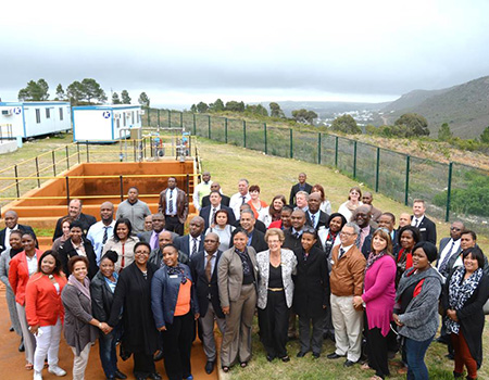 Executive Mayor, Nicolette Botha-Guthrie (centre) flanked by members of the South African National Defence College and their spouses, pictured at Preekstoel Biofilter plant with the Hemel and Aarde Valley in the background.
