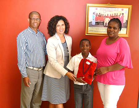 Akhule Mgoqi (centre), a grade-five learner at Zwelihle Primary is seen receiving a new school jersey from Charmaine Resandt (second left) PRO to Overstrand Mayor Nicolette Botha-Guthrie. Also in attendance were Nceba Laphi (first left), Zwelihle Primary Acting Deputy Principal (Intersen Phase) and Ntombizanele Booysen (first right), Zwelihle Primary Deputy Principal (Foundation Phase).